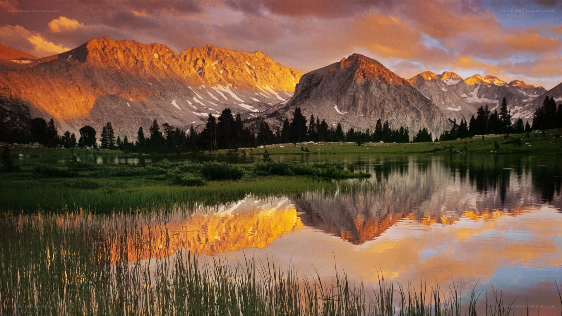 Mountain sunset reflected in lake