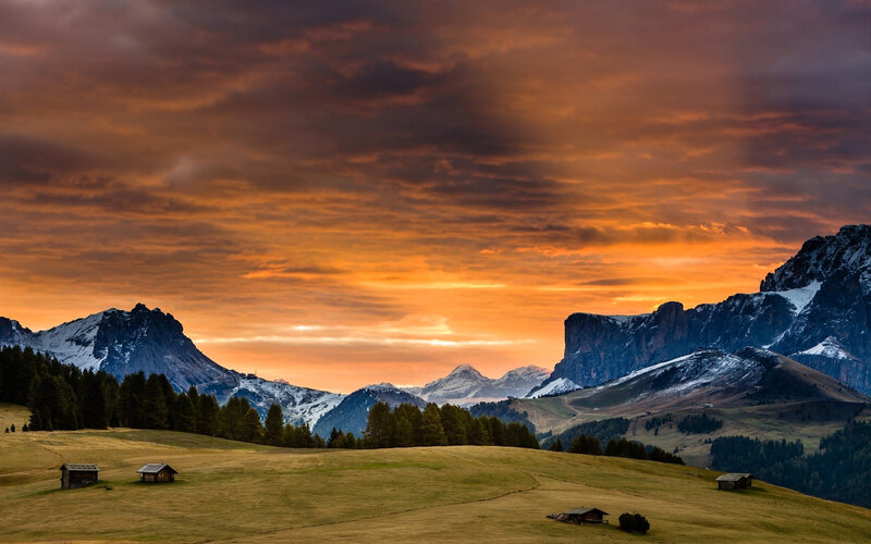 Mountain sunset with cabins