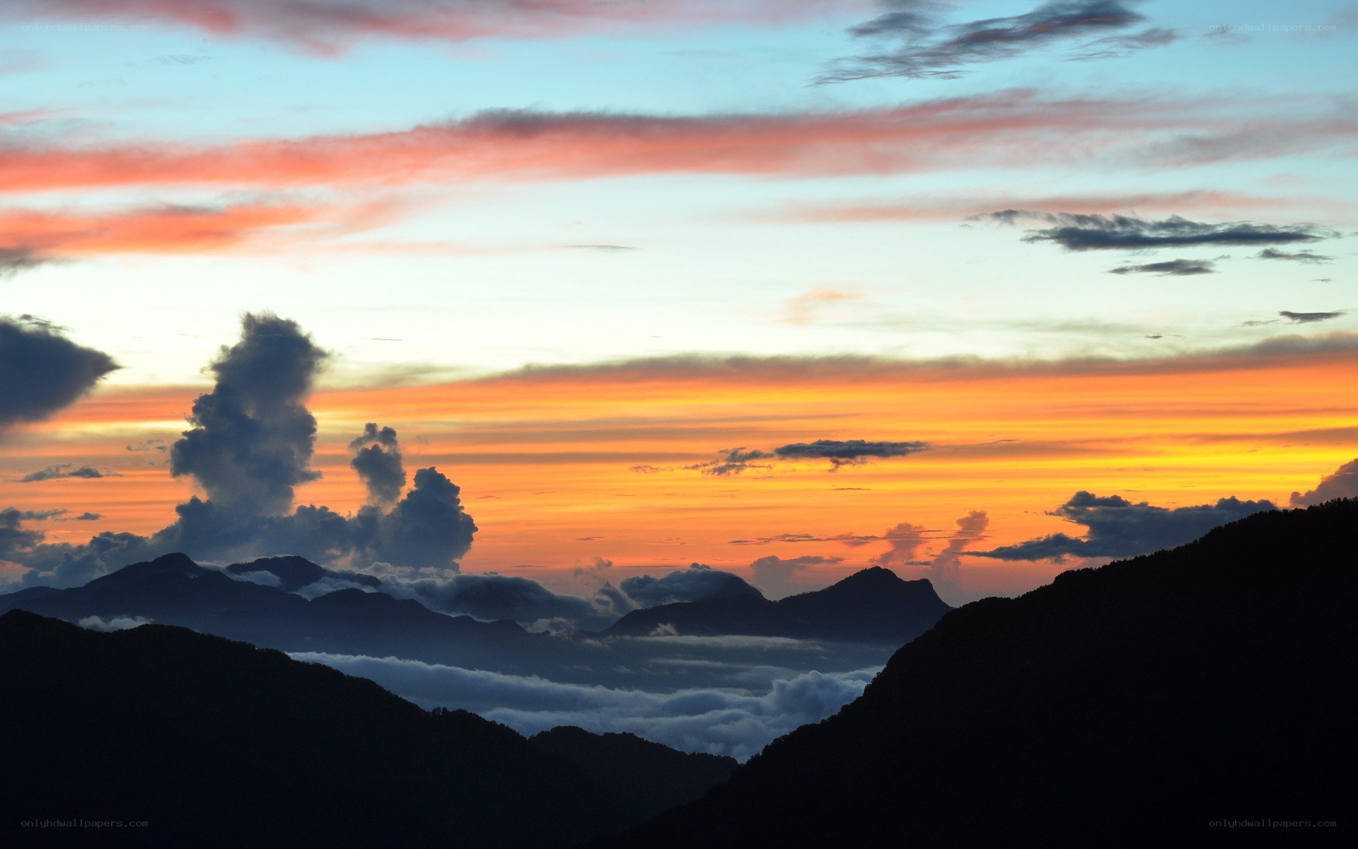 Mountain sunset with clouds