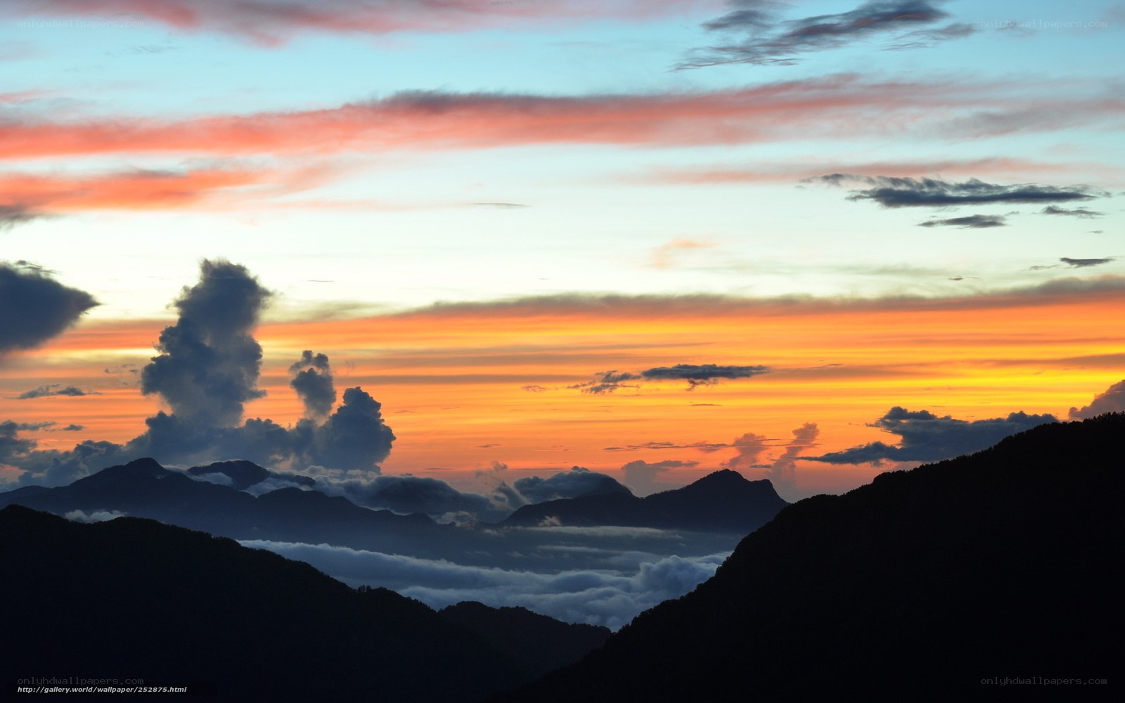 Mountain sunset with clouds