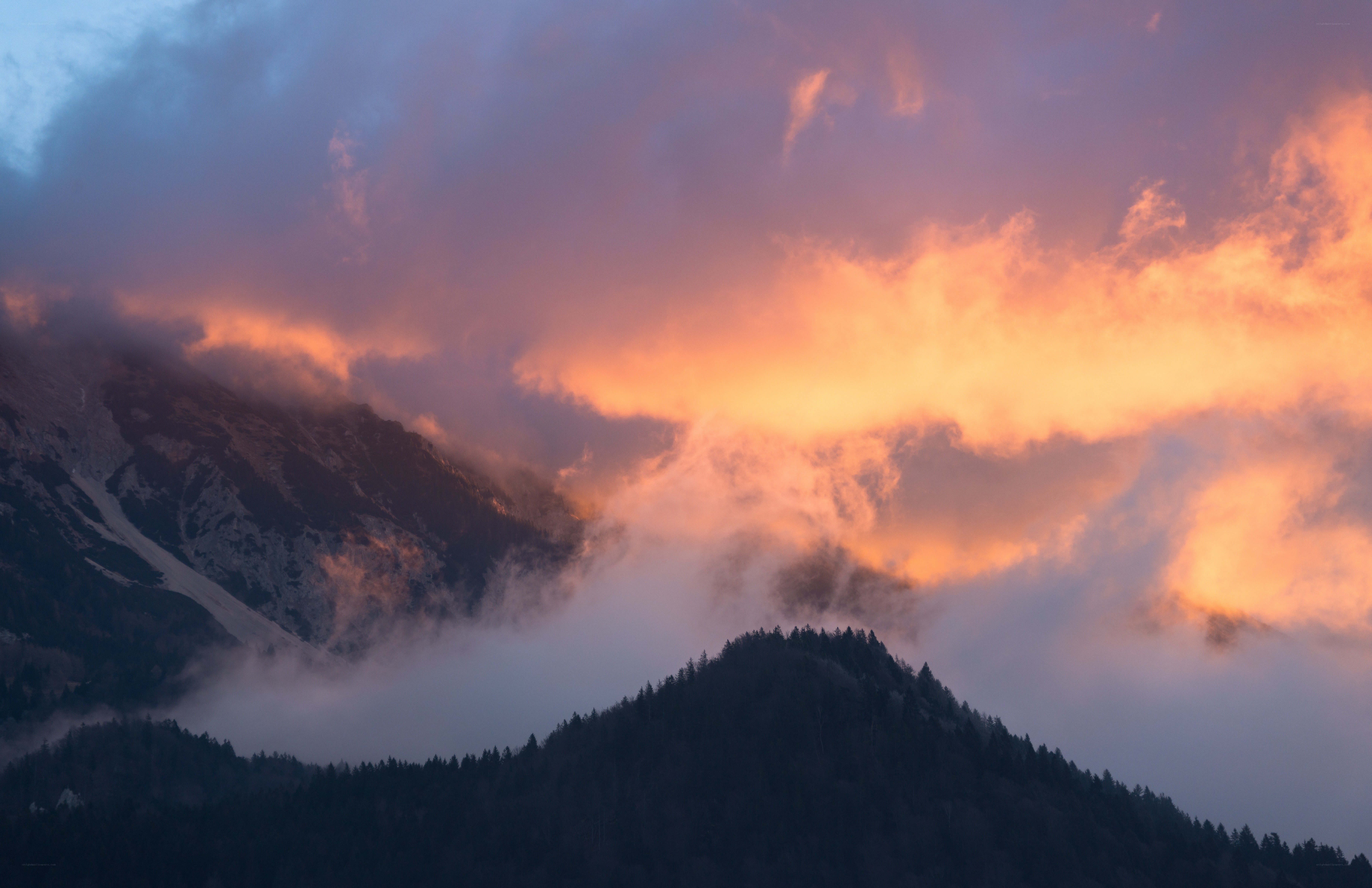 Mountain sunset with clouds