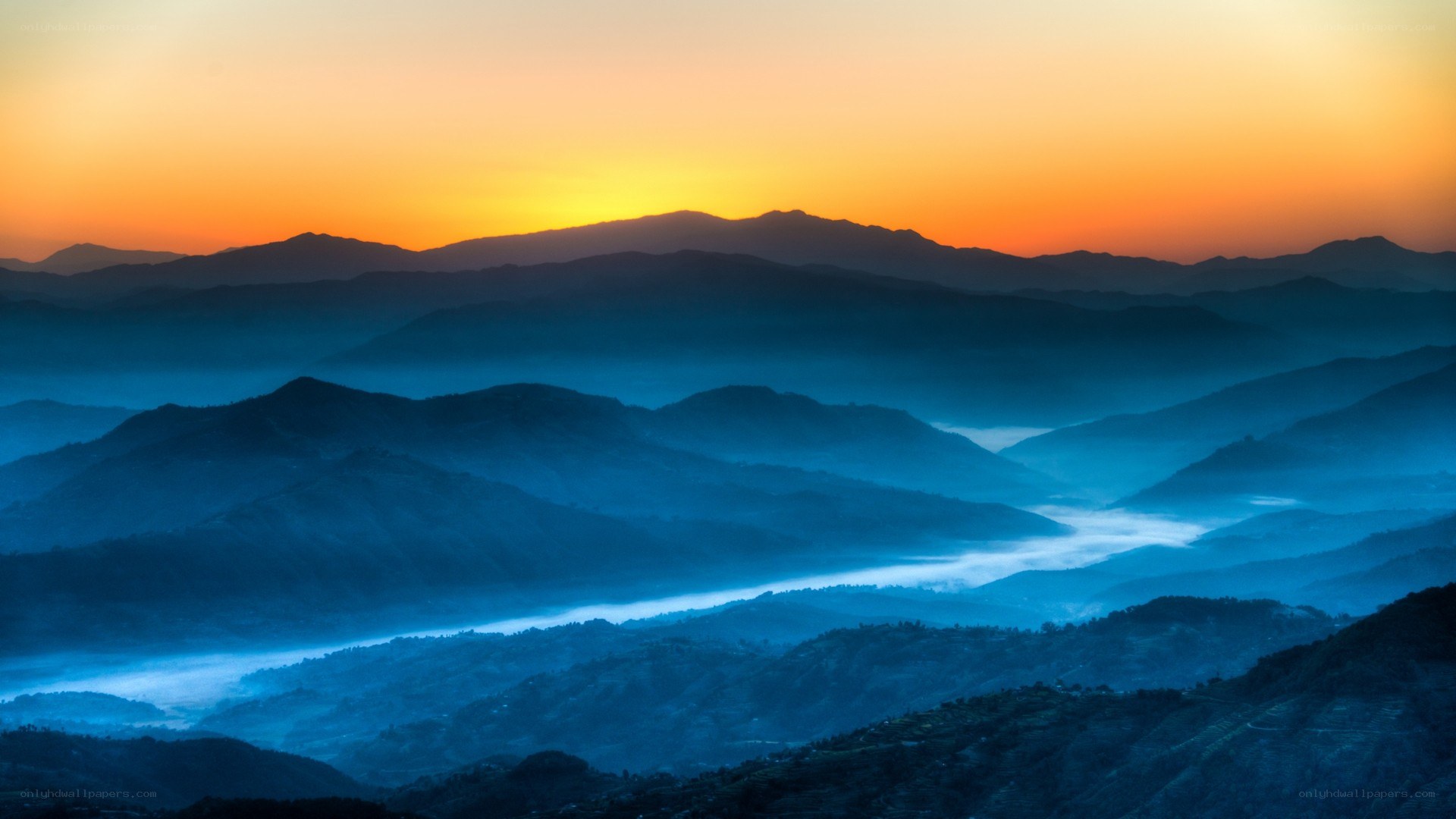 Mountain sunset with fog