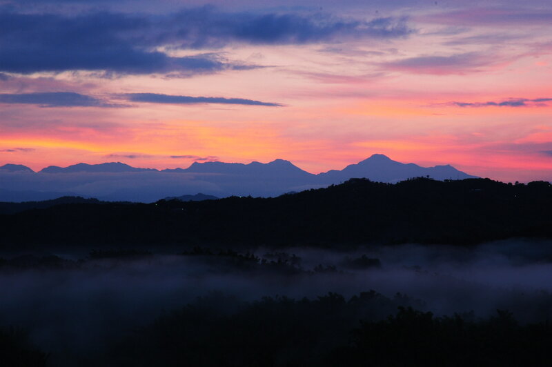 Mountain sunset with fog