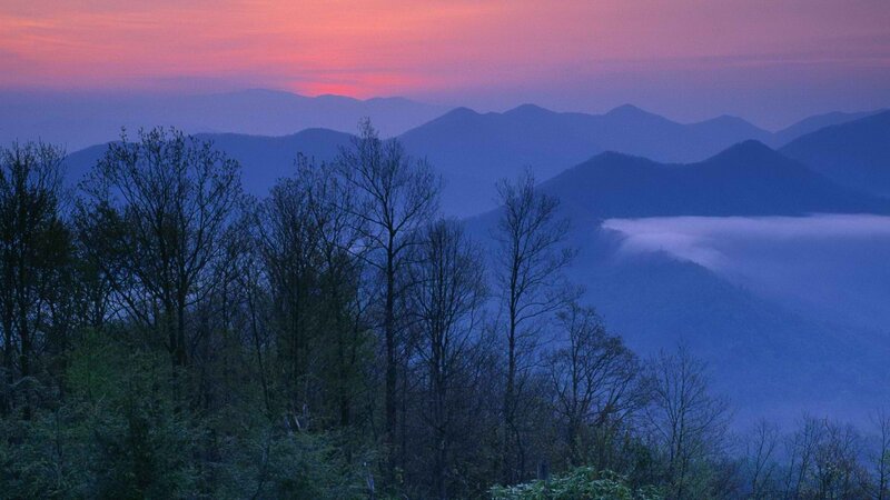 Mountain sunset with fog