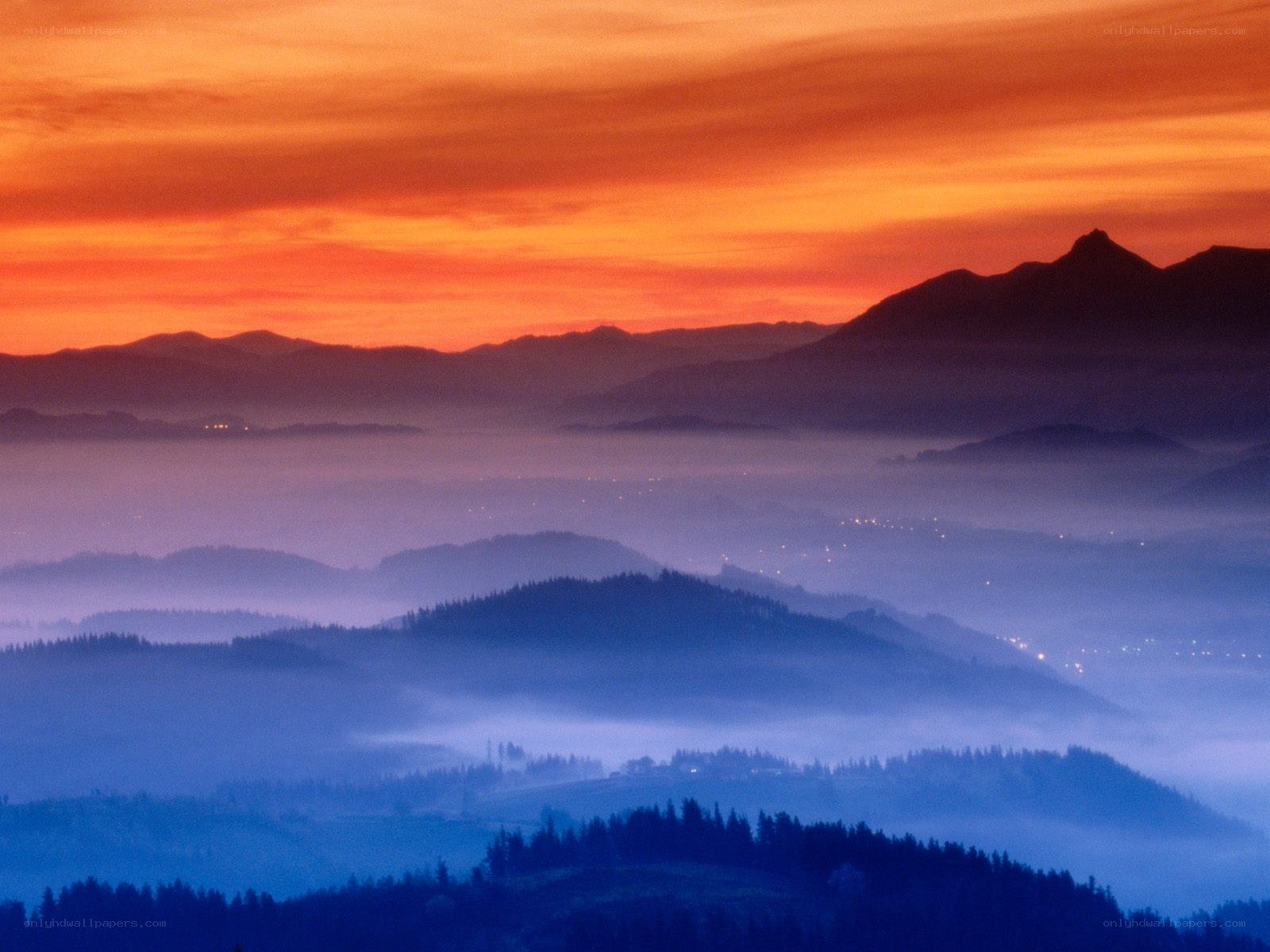 Mountain sunset with fog