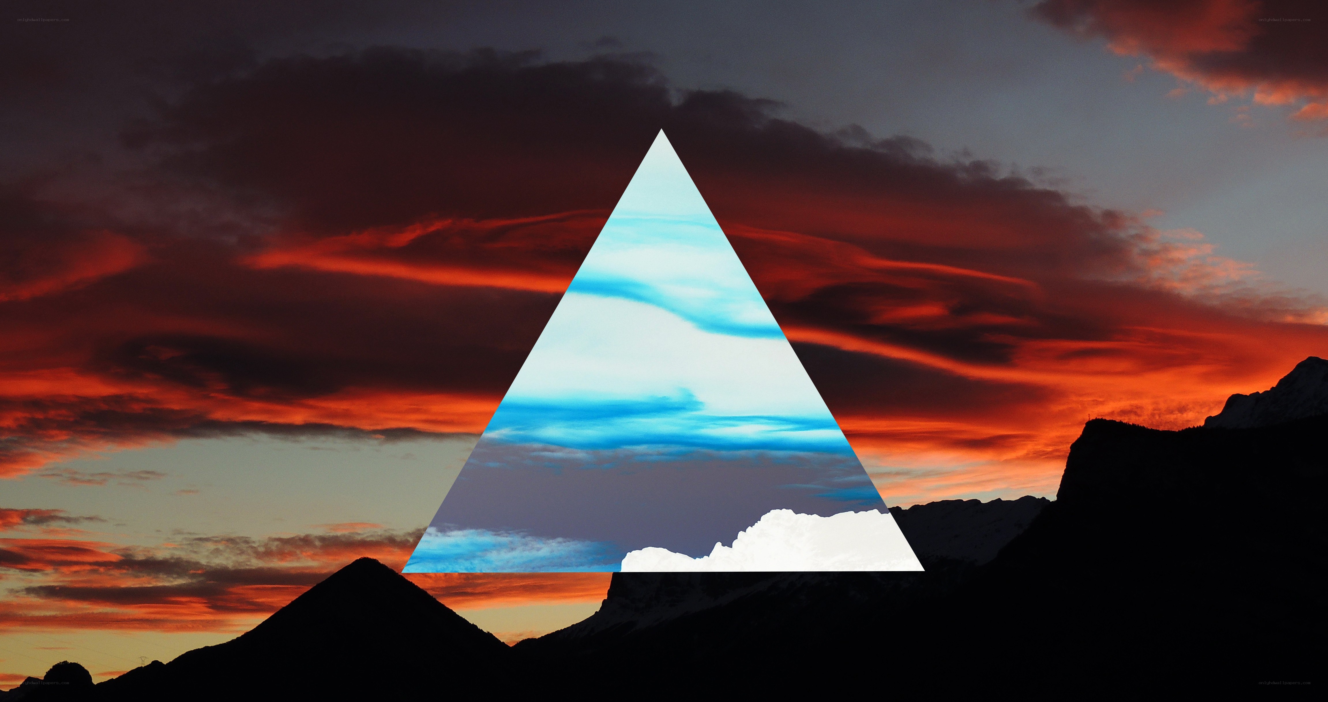 mountain sunset with geometric overlay