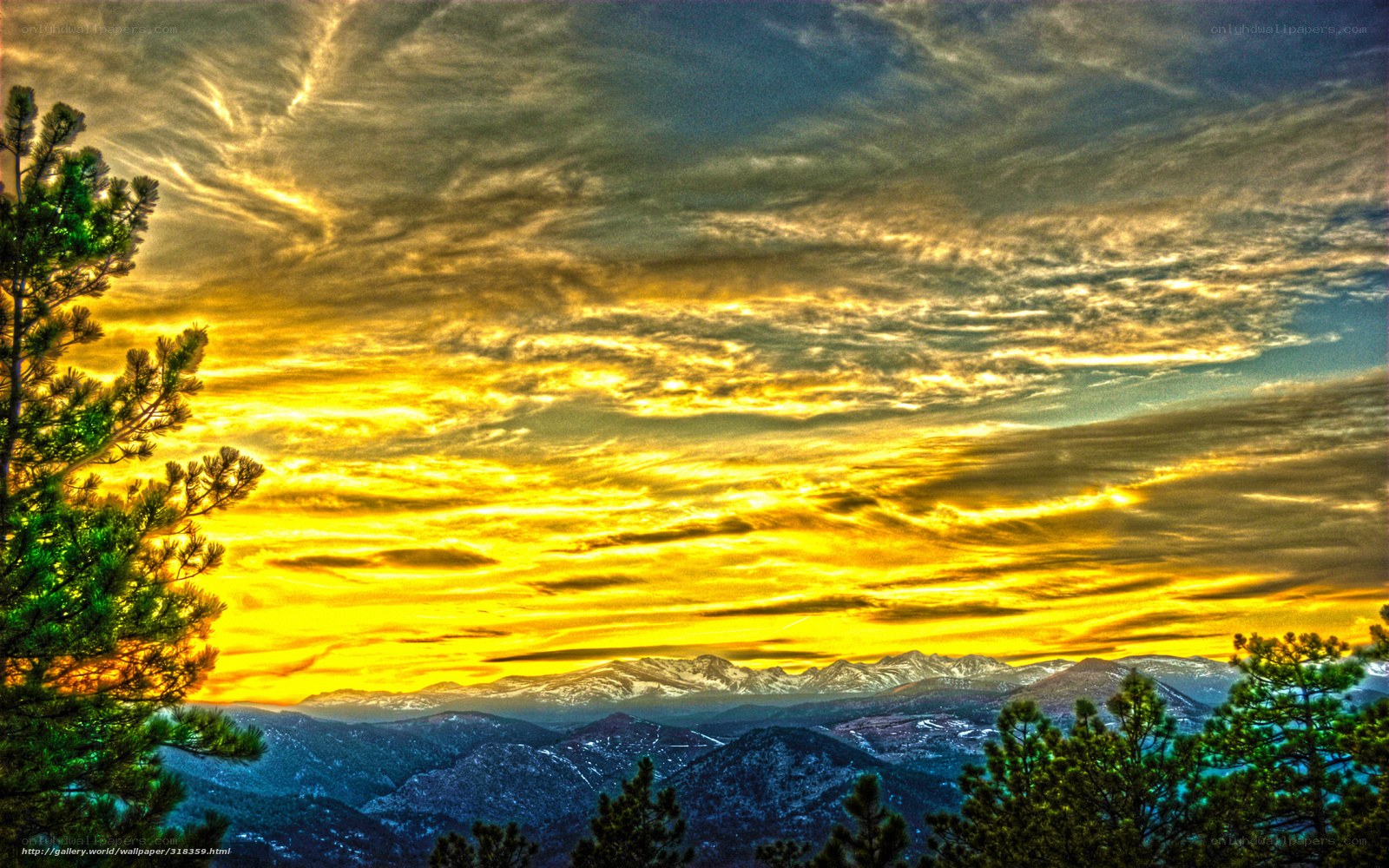 Mountain sunset with golden sky