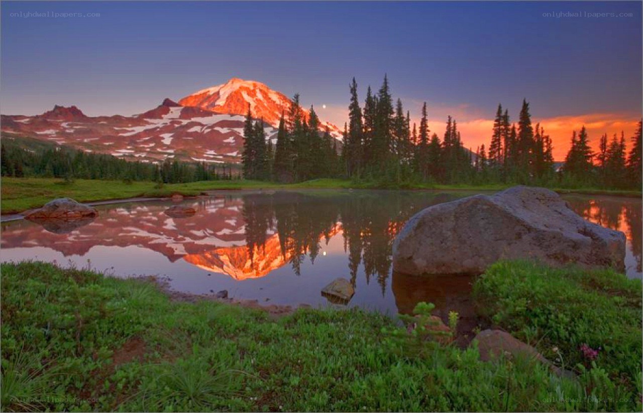 Mountain sunset with lake reflection