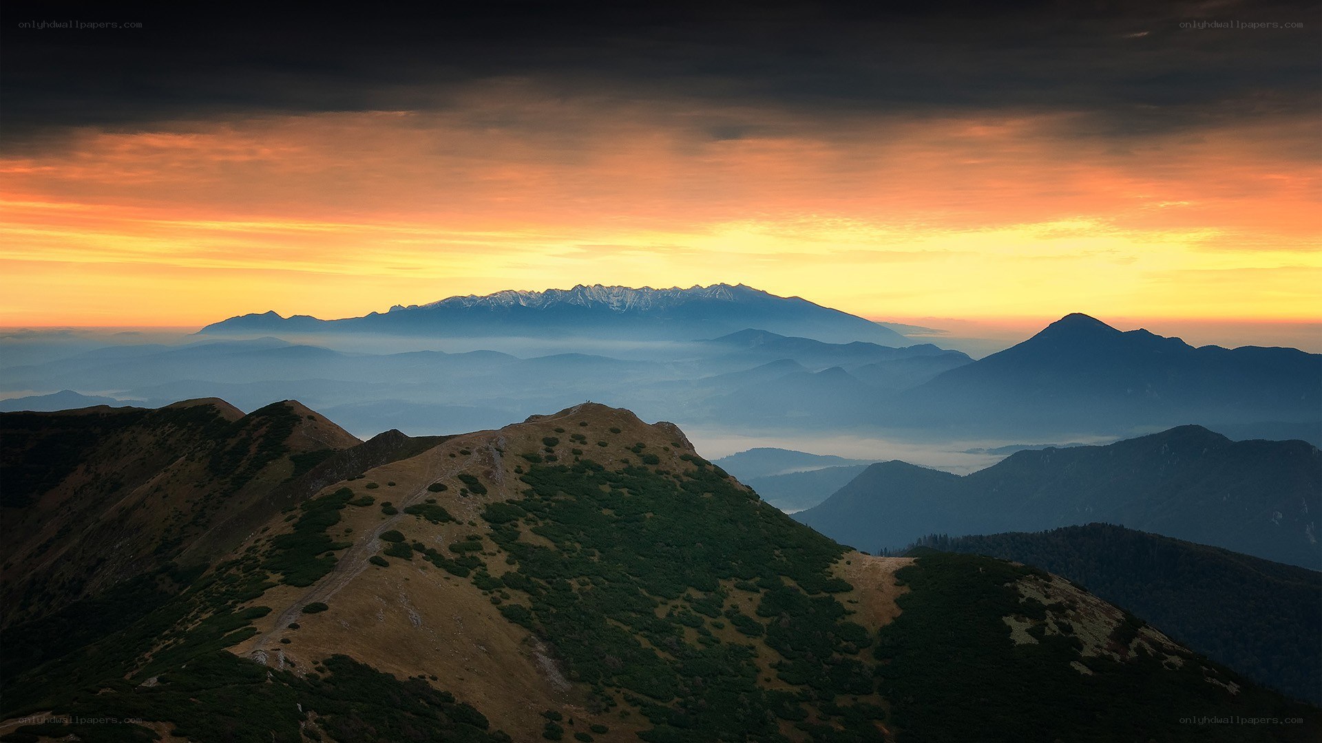 Mountain sunset with layered peaks