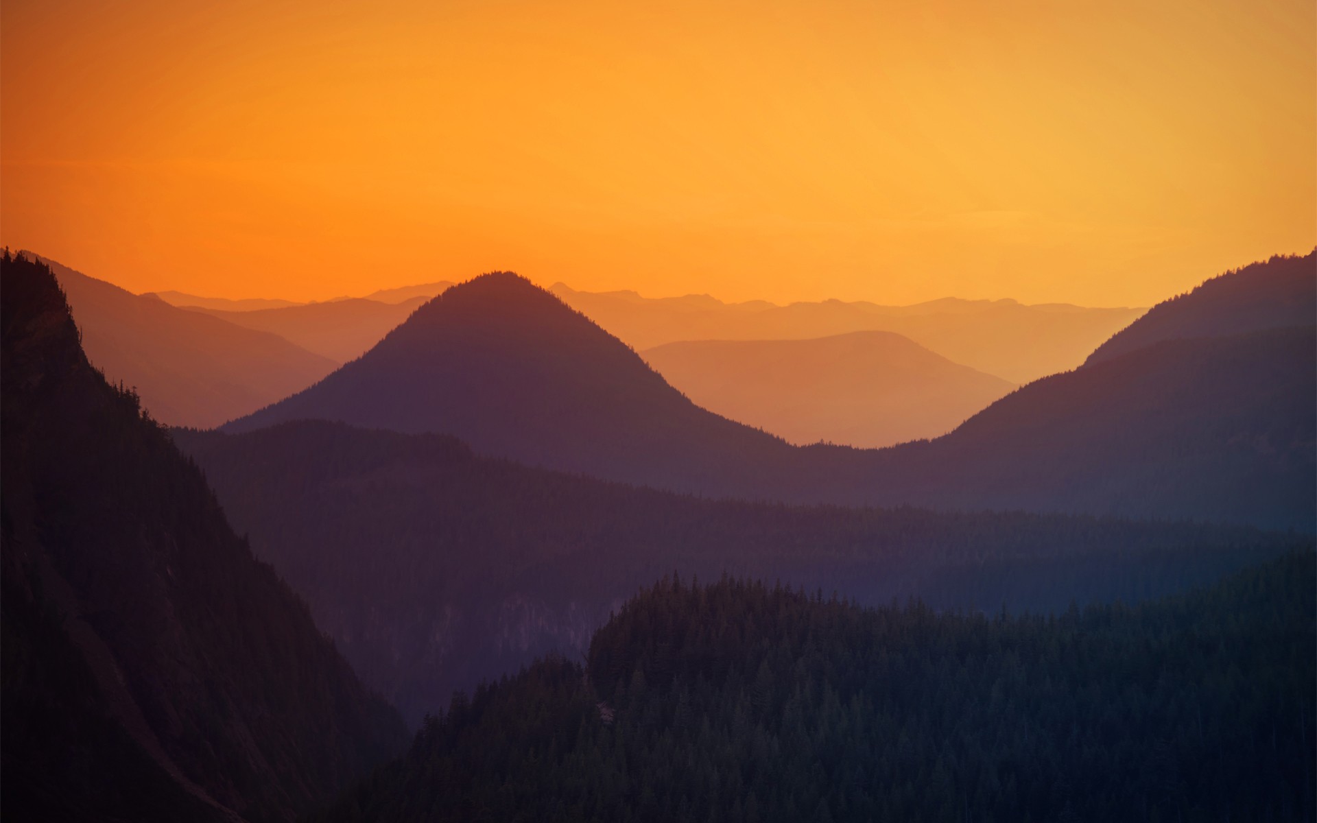 Mountain sunset with layered peaks