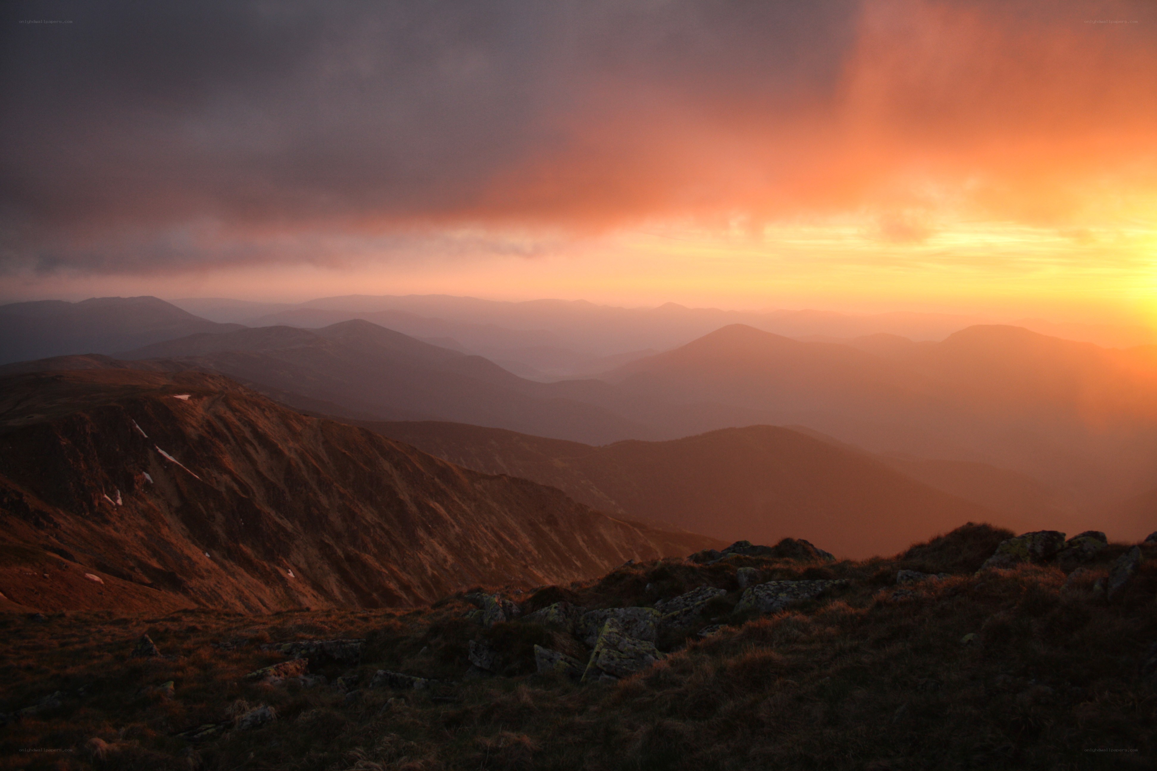 Mountain sunset with layered peaks