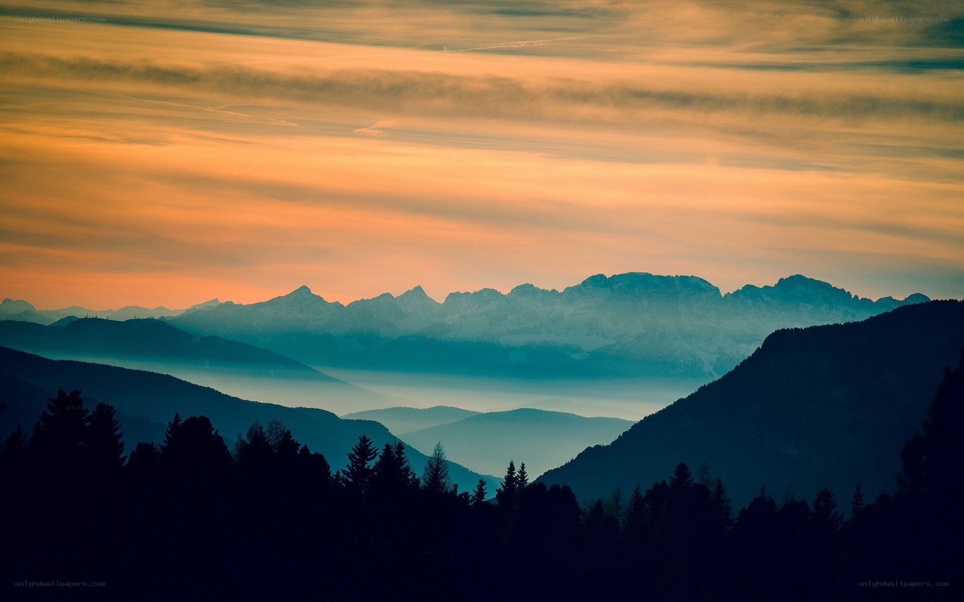 Mountain sunset with layered peaks