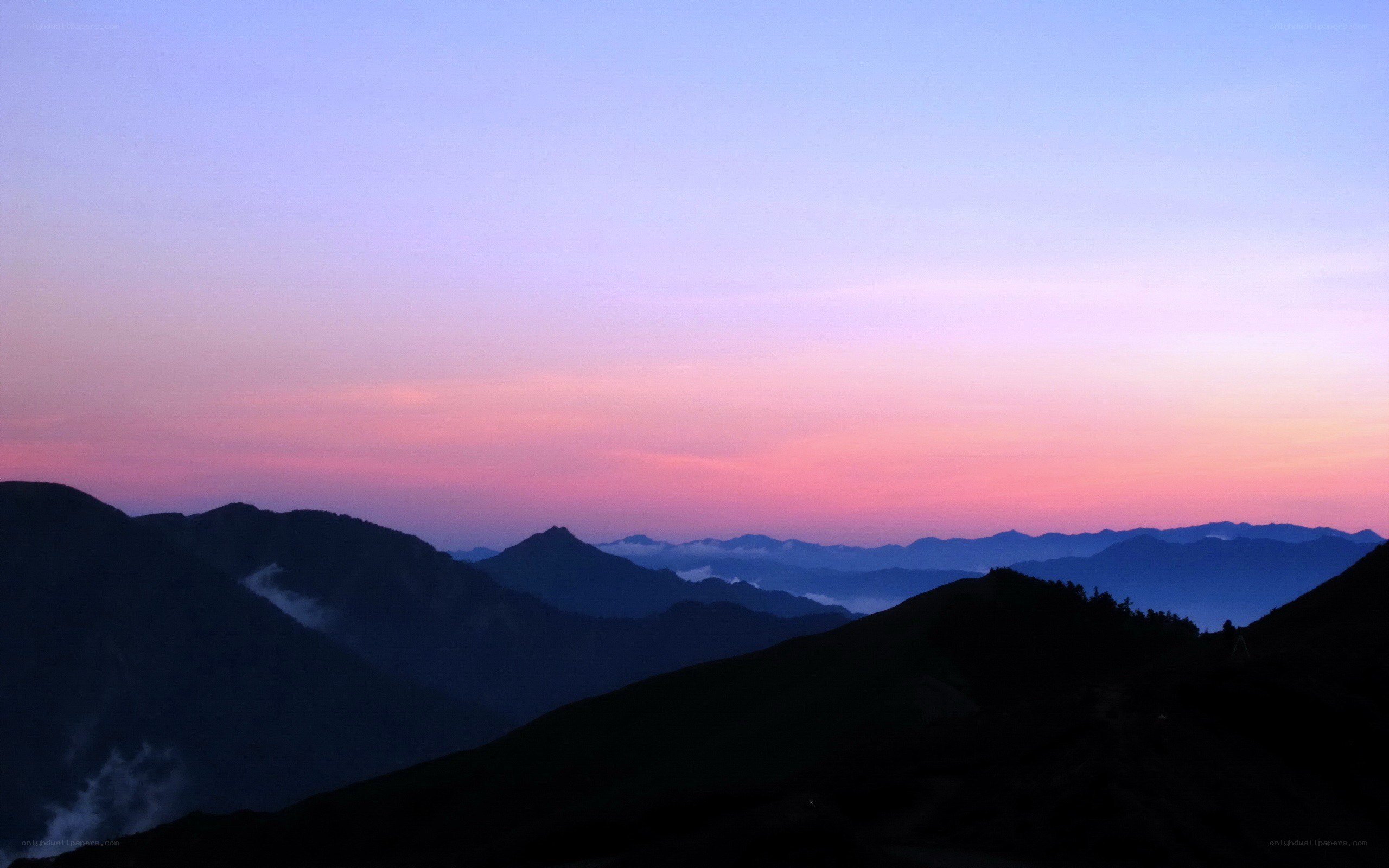 Mountain sunset with layered peaks