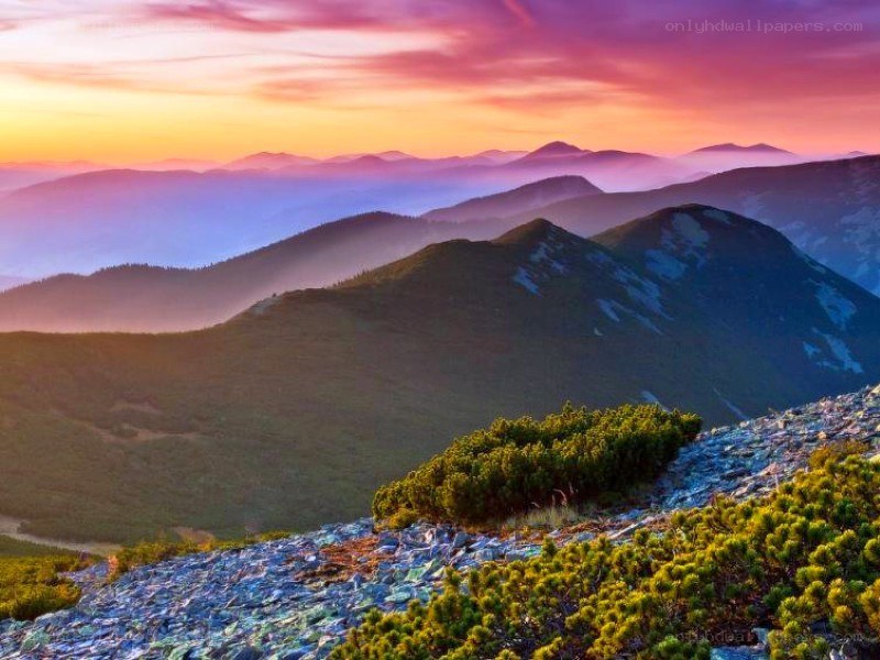 Mountain sunset with layered peaks