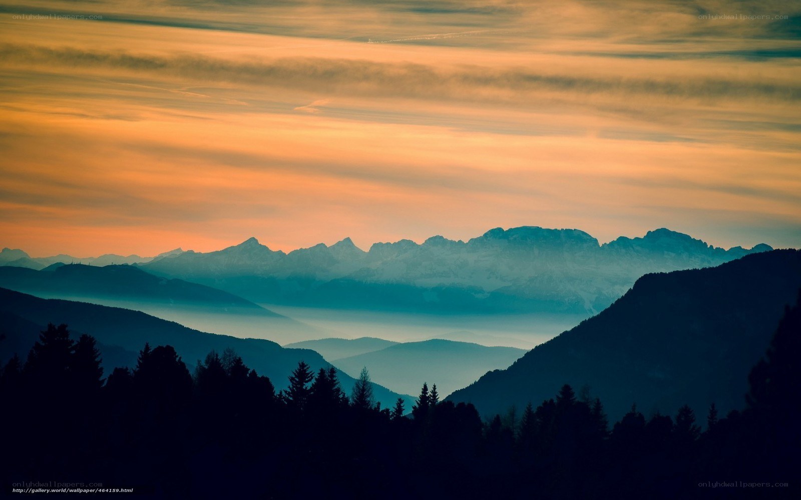Mountain sunset with layered peaks