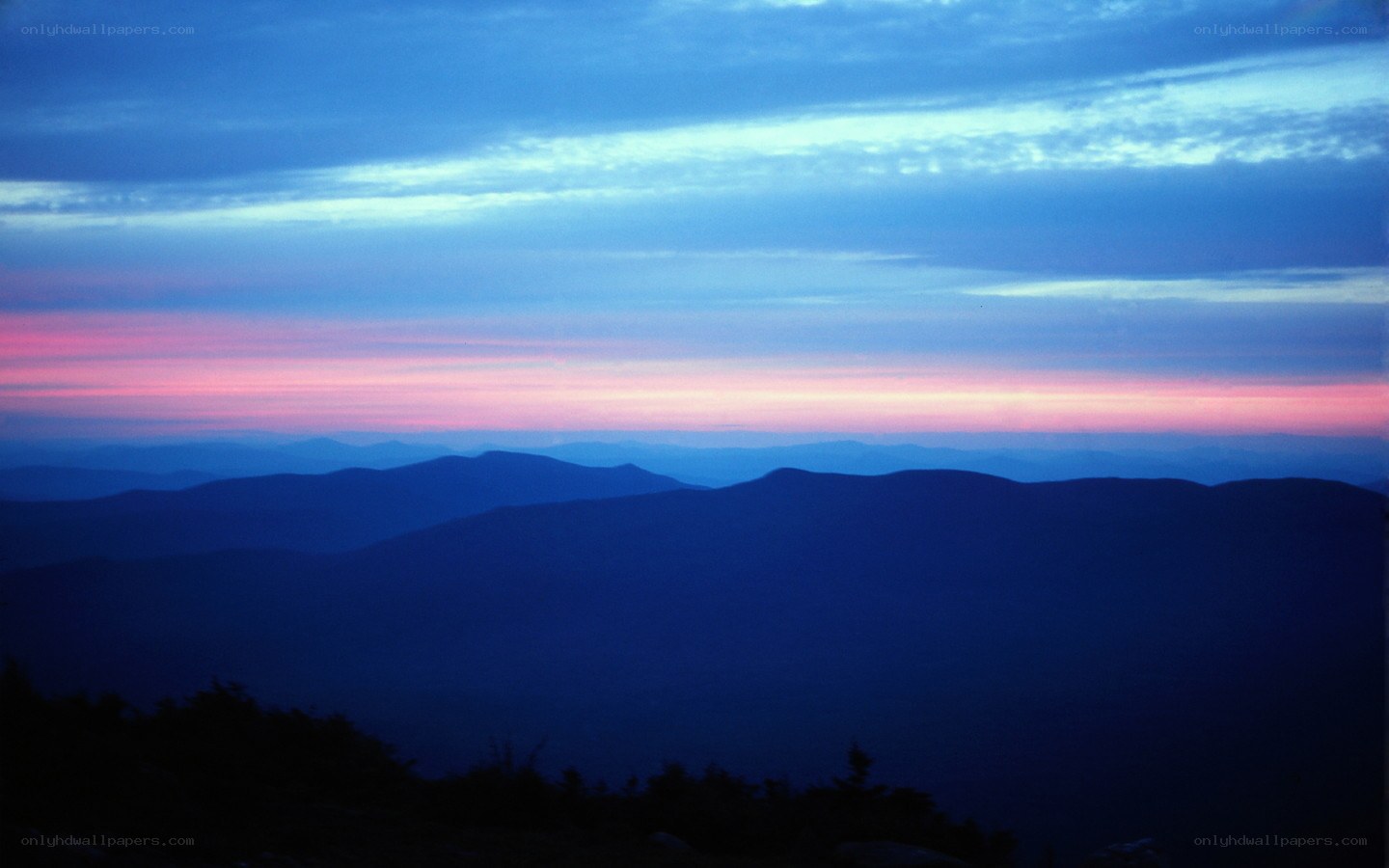 Mountain sunset with layered silhouettes