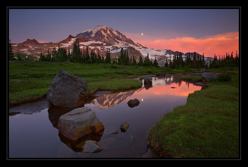 Mountain sunset with moon reflection