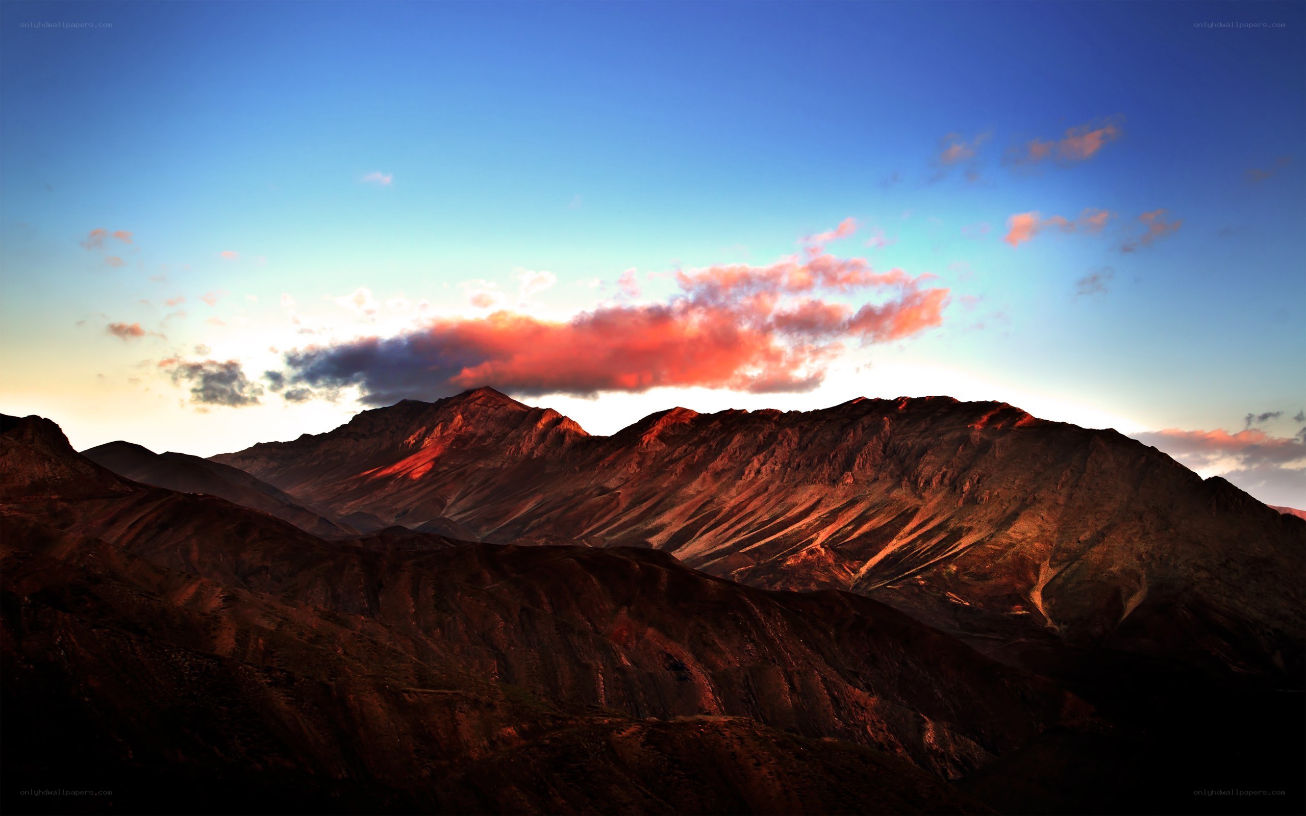 Mountain sunset with pink clouds