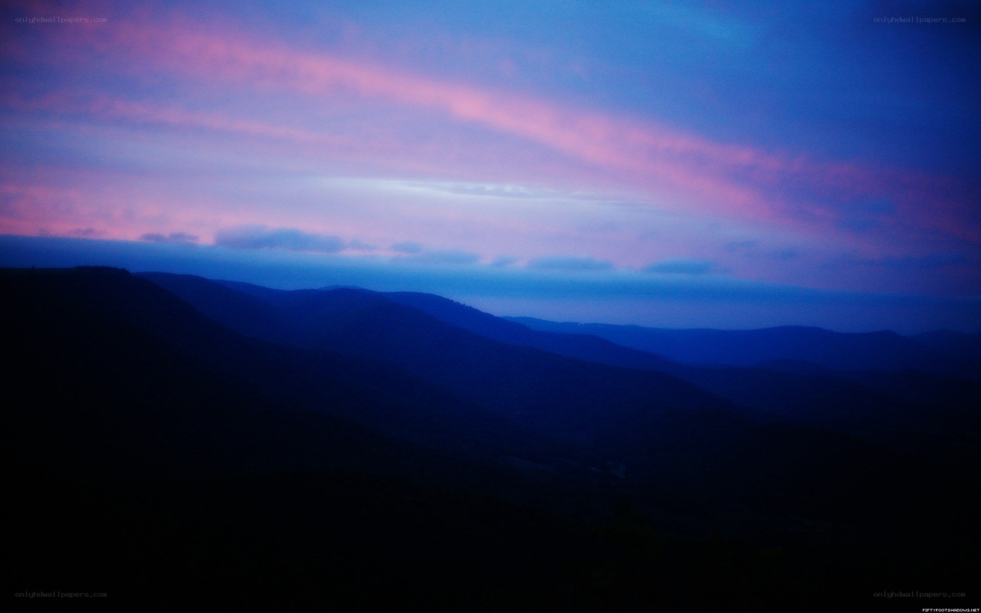 mountain sunset with purple sky