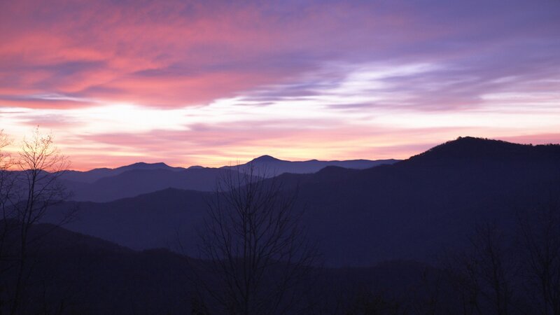 mountain sunset with purple sky