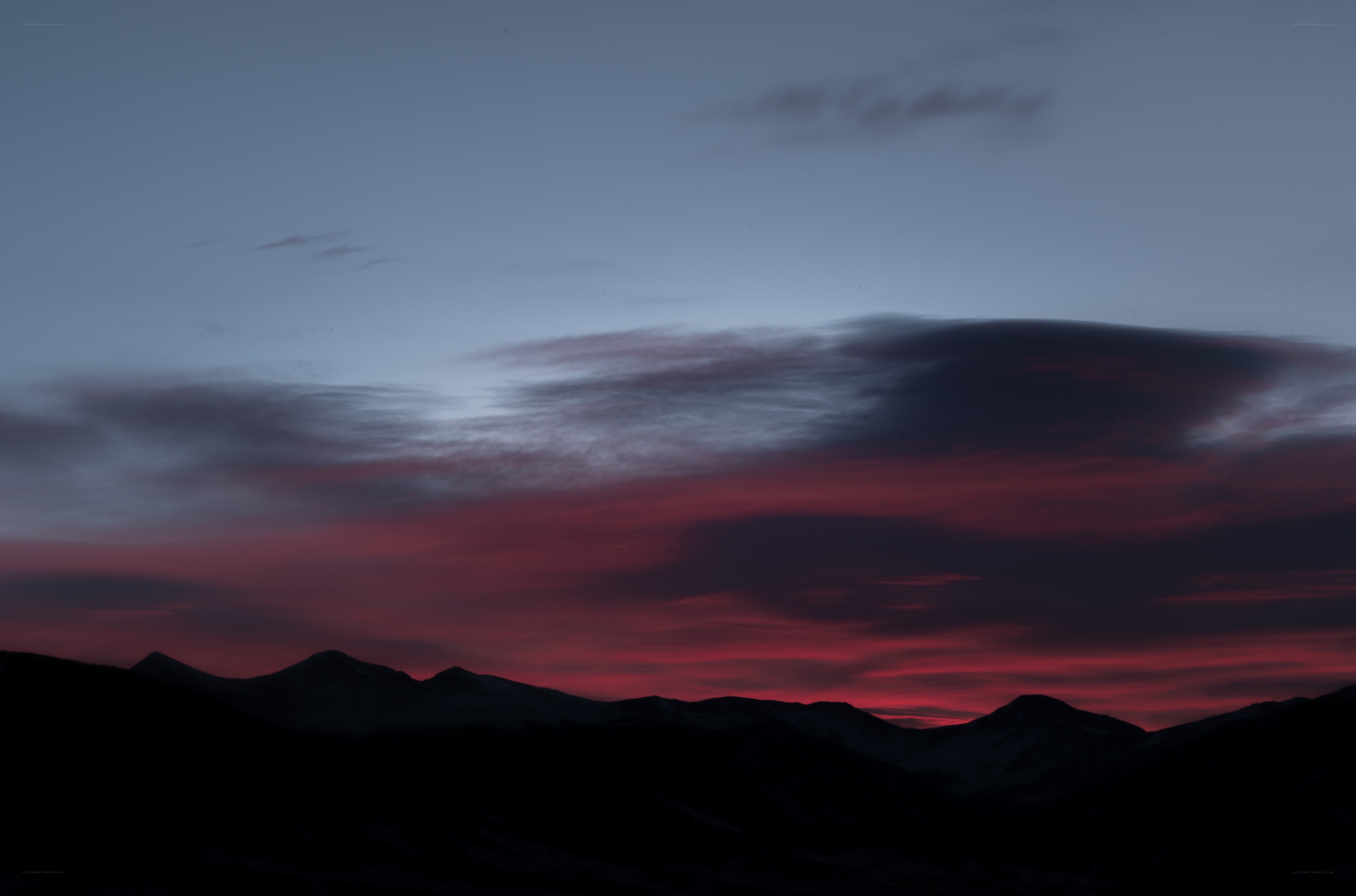 Mountain sunset with red clouds