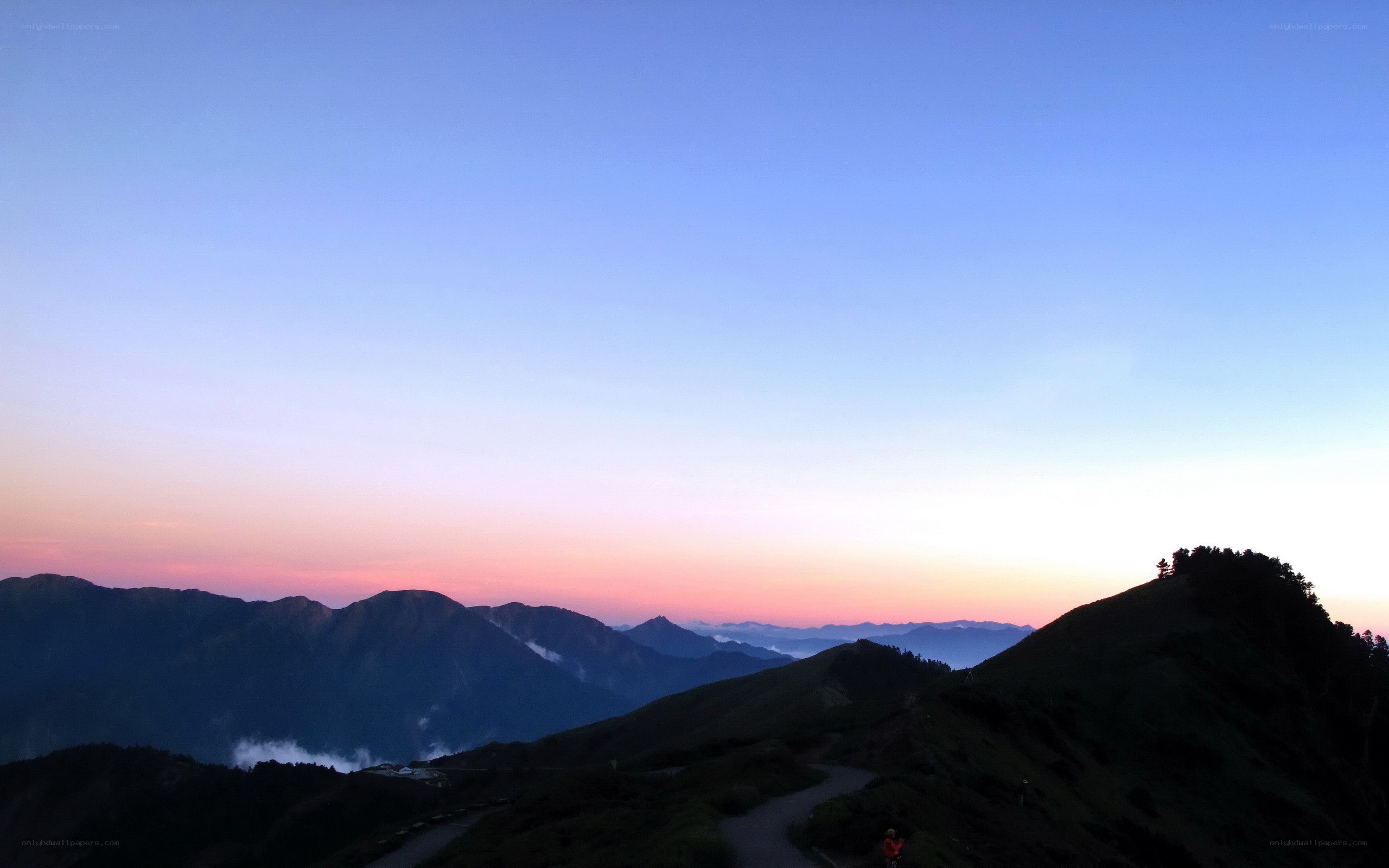 Mountain sunset with winding path
