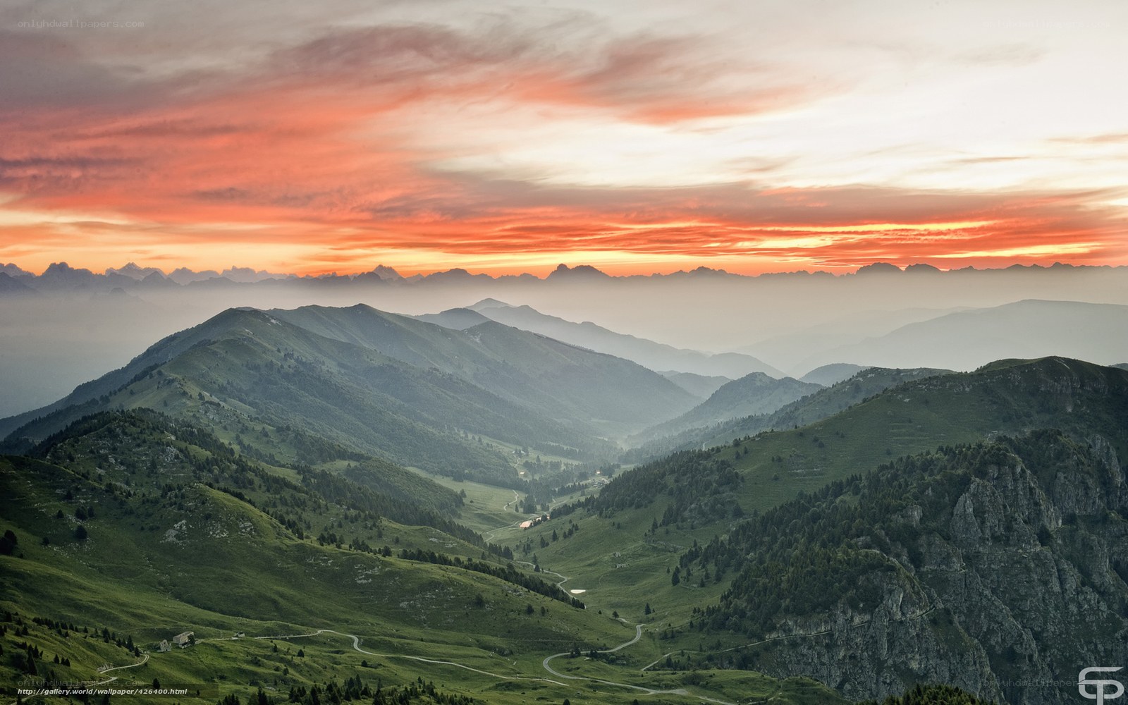 Mountain sunset with winding roads