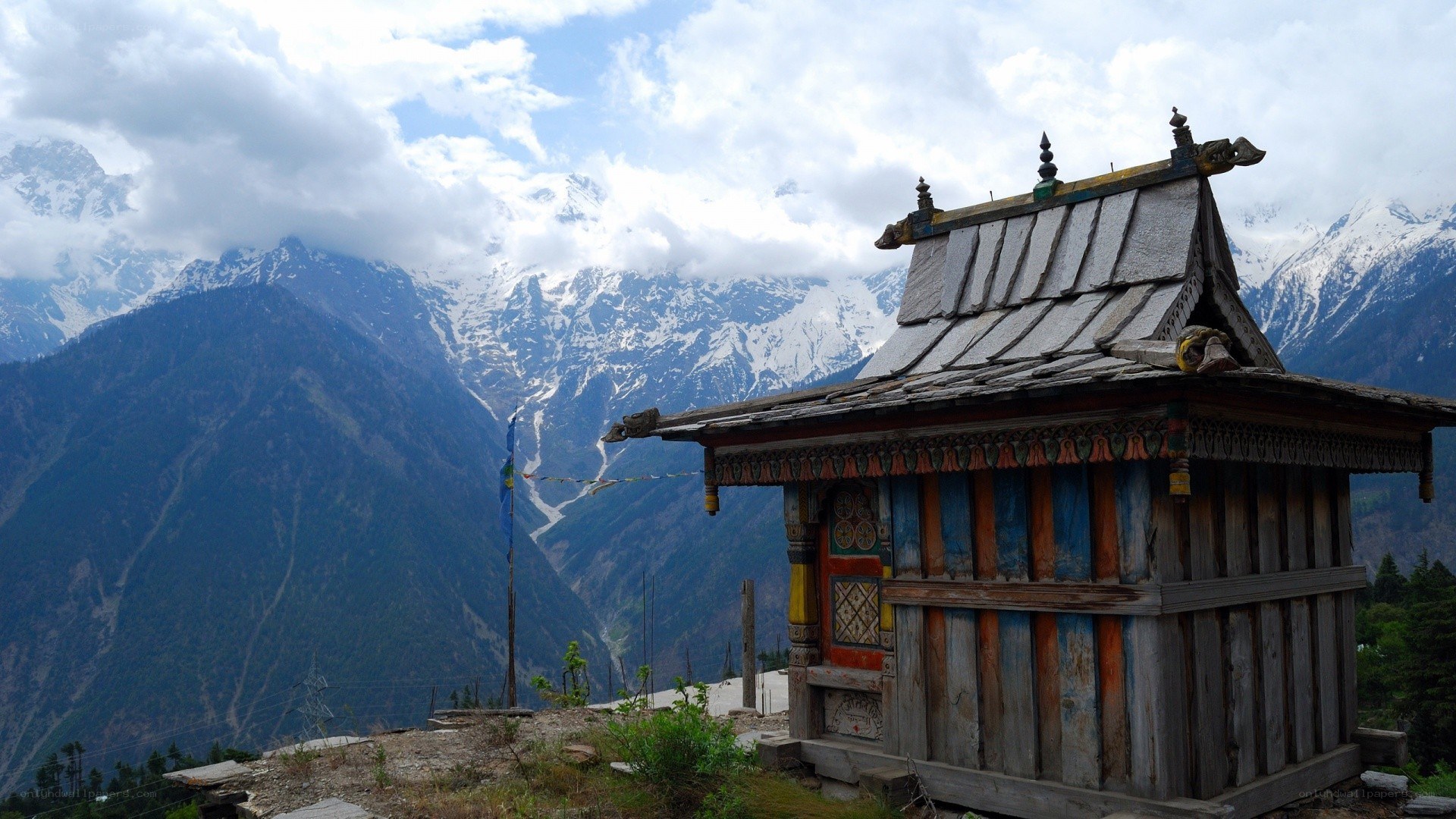 Mountain temple with snow-capped peaks