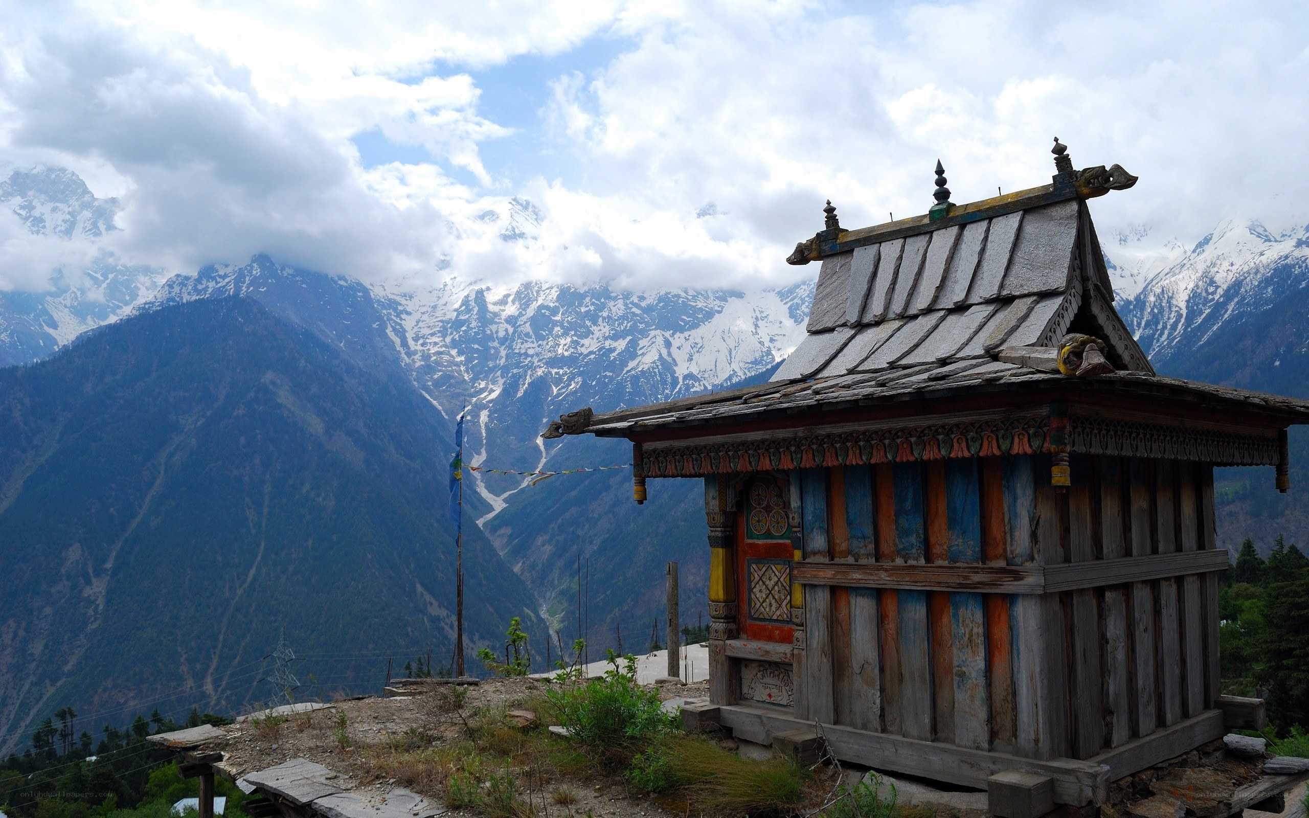 Mountain temple with snow-capped peaks