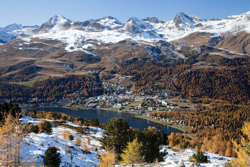 Mountain town by a lake in autumn