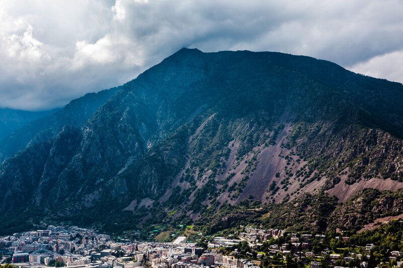 Mountain town under cloudy sky