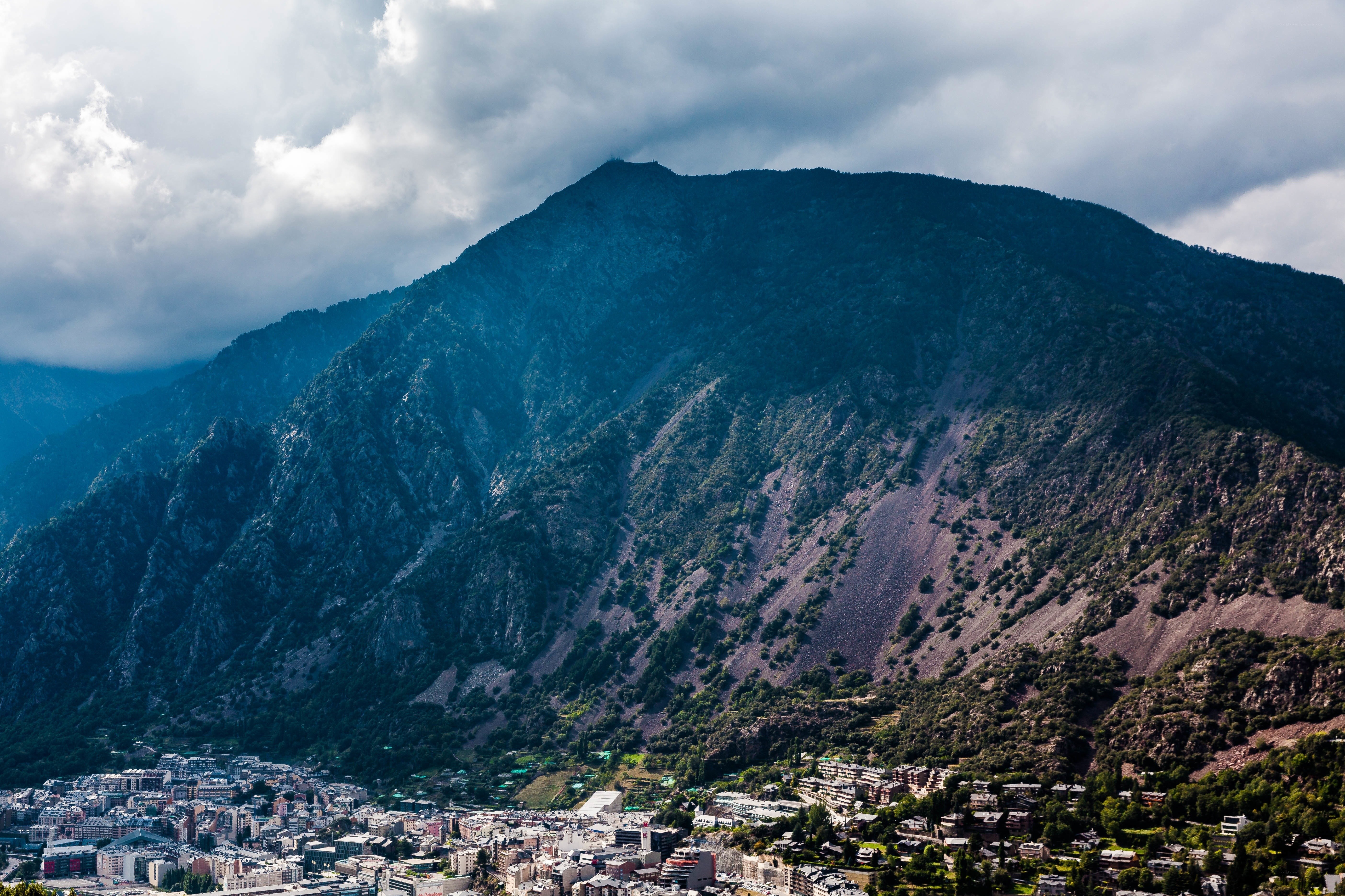 Mountain town under cloudy sky