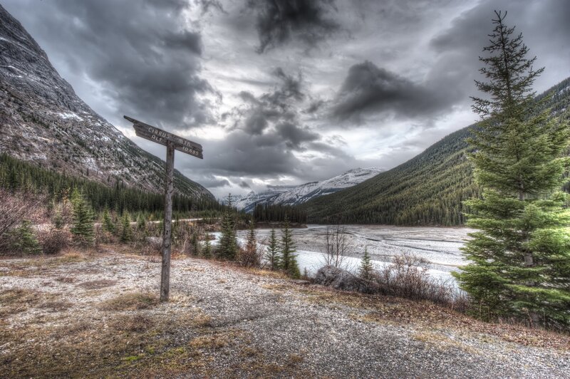 Mountain trail sign in valley