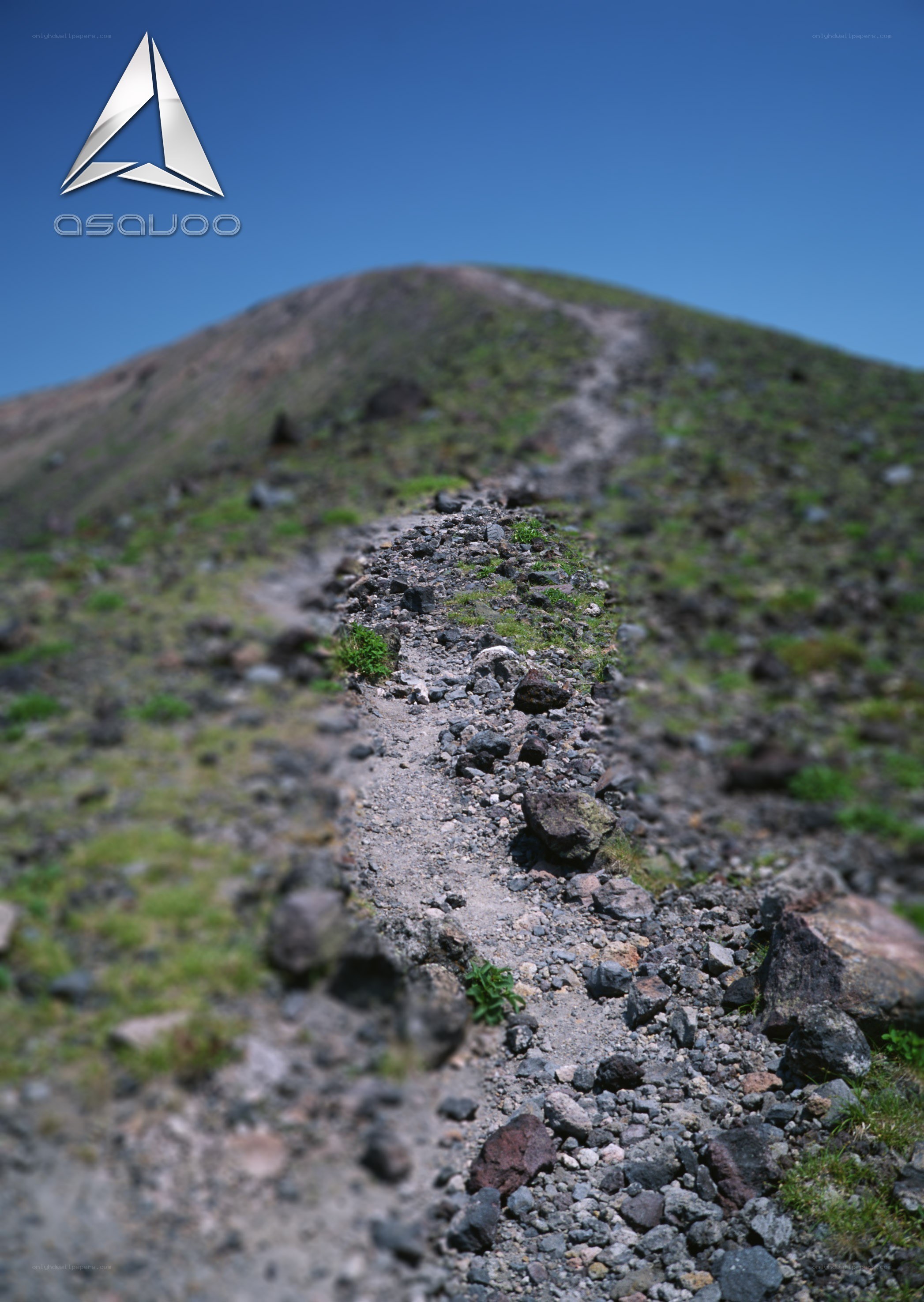 Mountain trail under blue sky