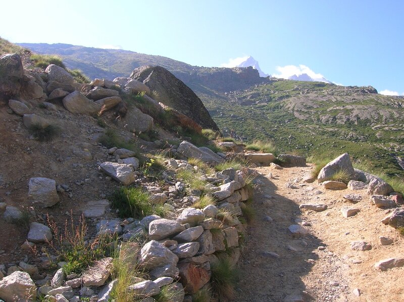Mountain trail with distant peak