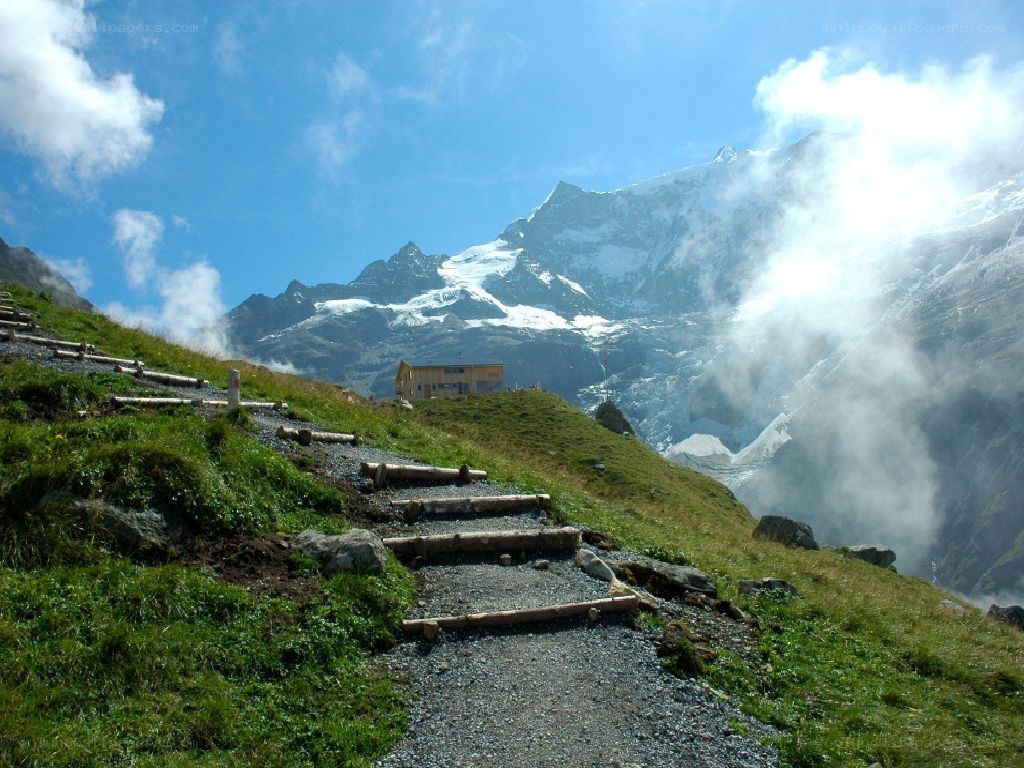Mountain trail with snow-capped peaks