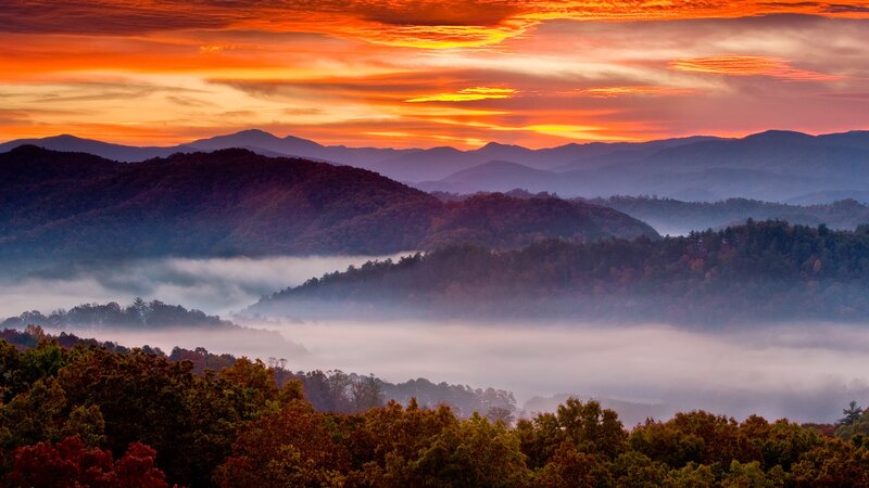 Mountain Valley at Sunrise — Orange, Serene, Photograph, Fog, Trees, Clouds