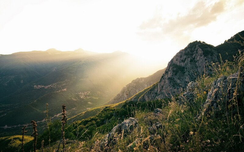 Mountain Valley at Sunset — Green, Serene, Photograph, Mountains, Sunlight, Grass, Brown