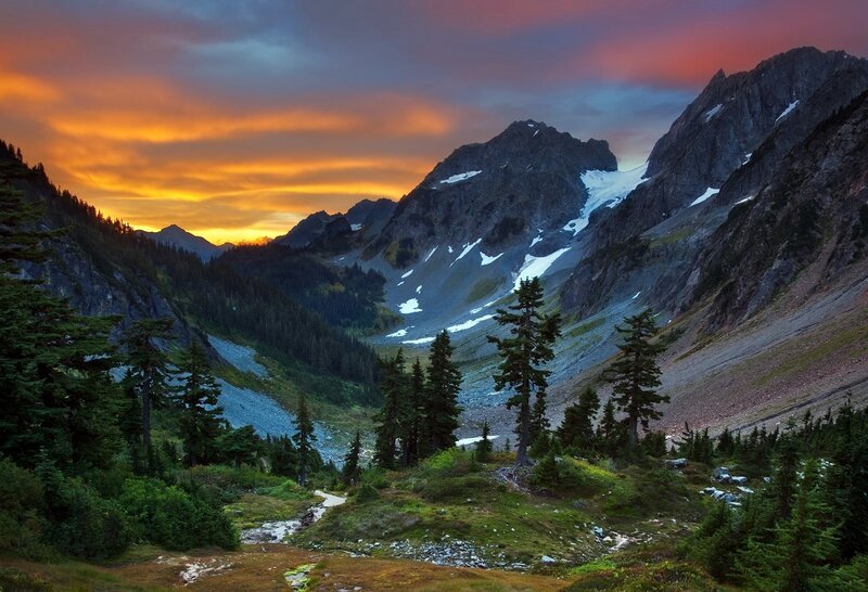 Mountain Valley at Sunset — Orange, Dramatic, Photograph, Trees, Snow, Clouds