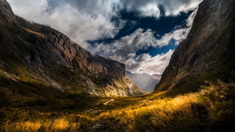 Mountain Valley Landscape — Green, Dramatic, Afternoon, Photograph, Mountains, Road, Clouds