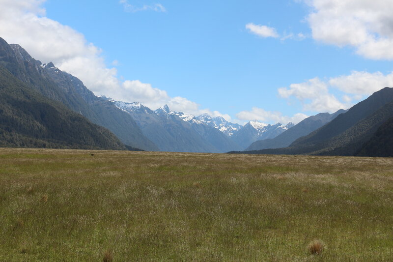 Mountain Valley Landscape — Green, Serene, Afternoon, Photograph, Grass Field