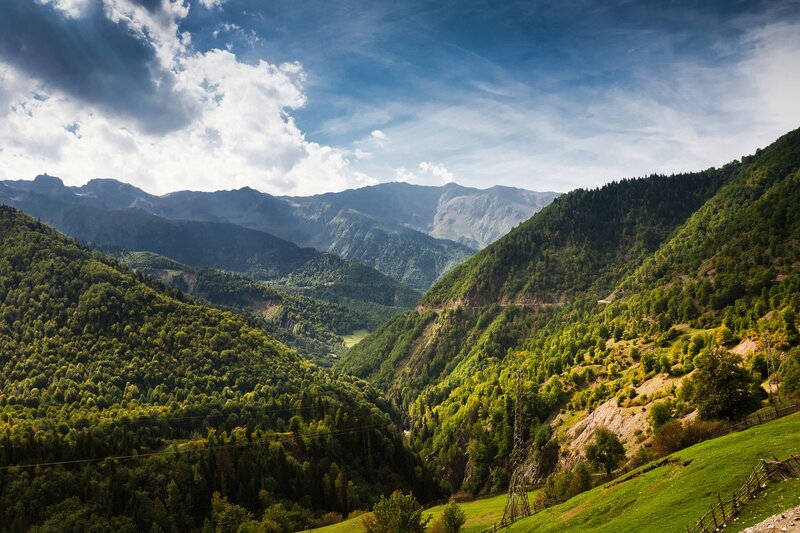Mountain Valley Landscape — Green, Serene, Afternoon, Photograph, Mountains, Forests, Blue