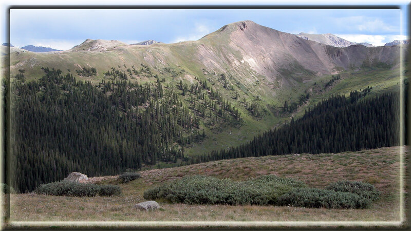 Mountain Valley Landscape — Green, Serene, Afternoon, Photograph, Trees, Rocks, Sky