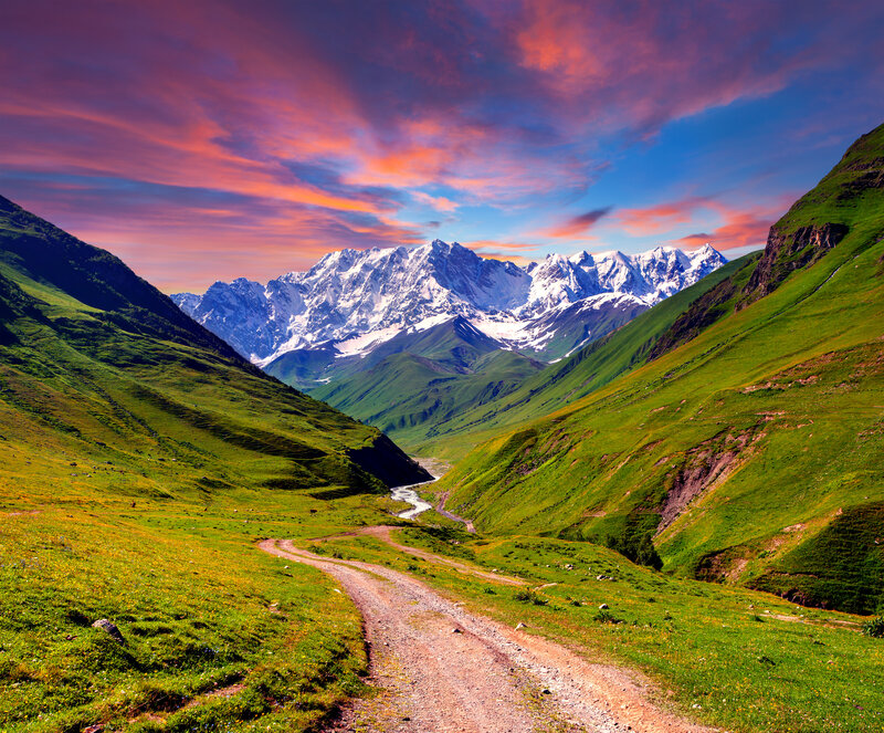 Mountain Valley Landscape — Green, Serene, Sunset, Photograph, Snow-capped Mountains
