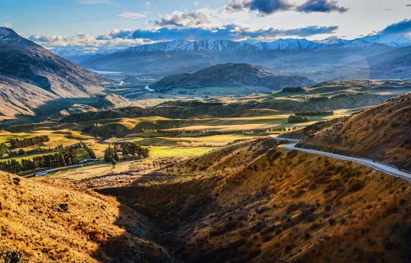 Mountain valley landscape with winding road