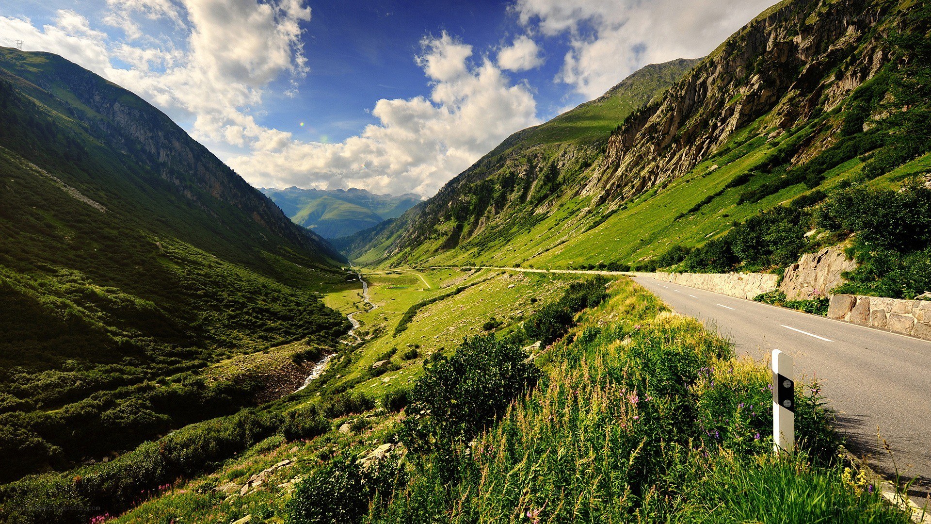 Mountain valley road with river