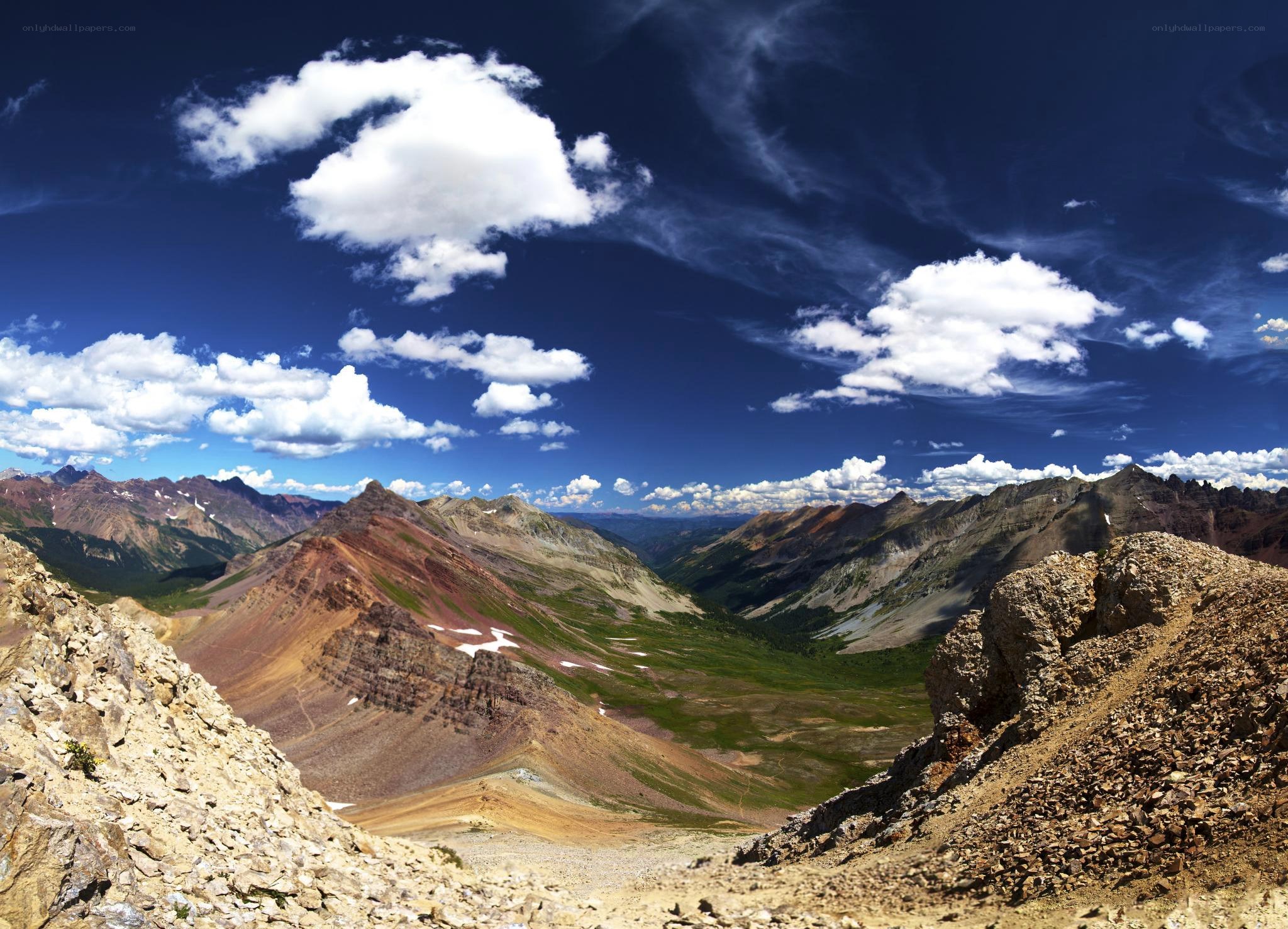 mountain valley under blue sky