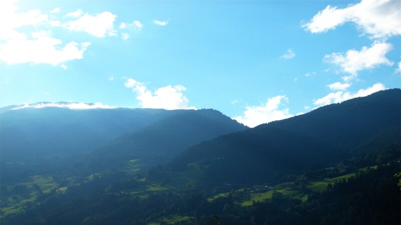 Mountain valley under blue sky