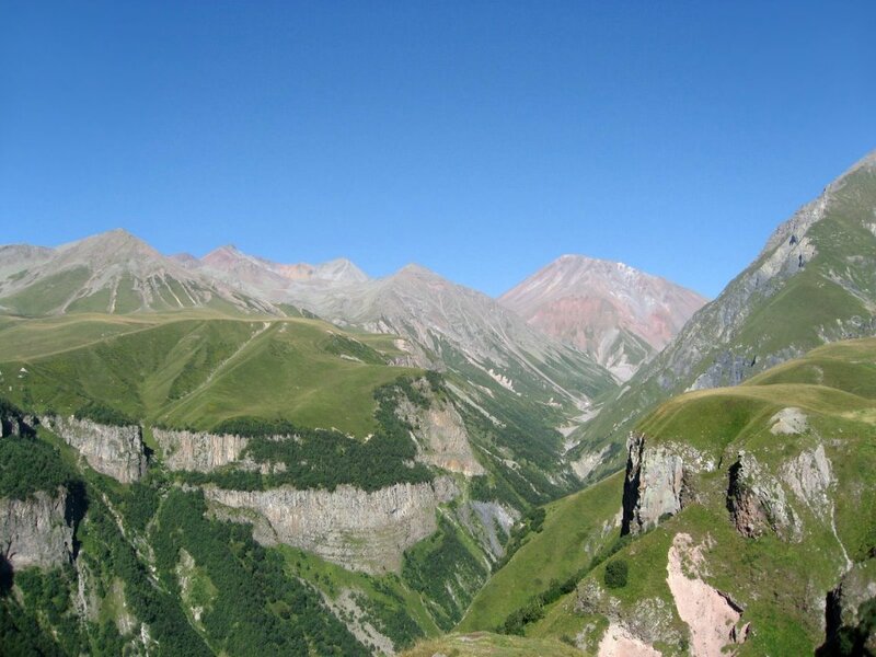 Mountain valley under clear blue sky