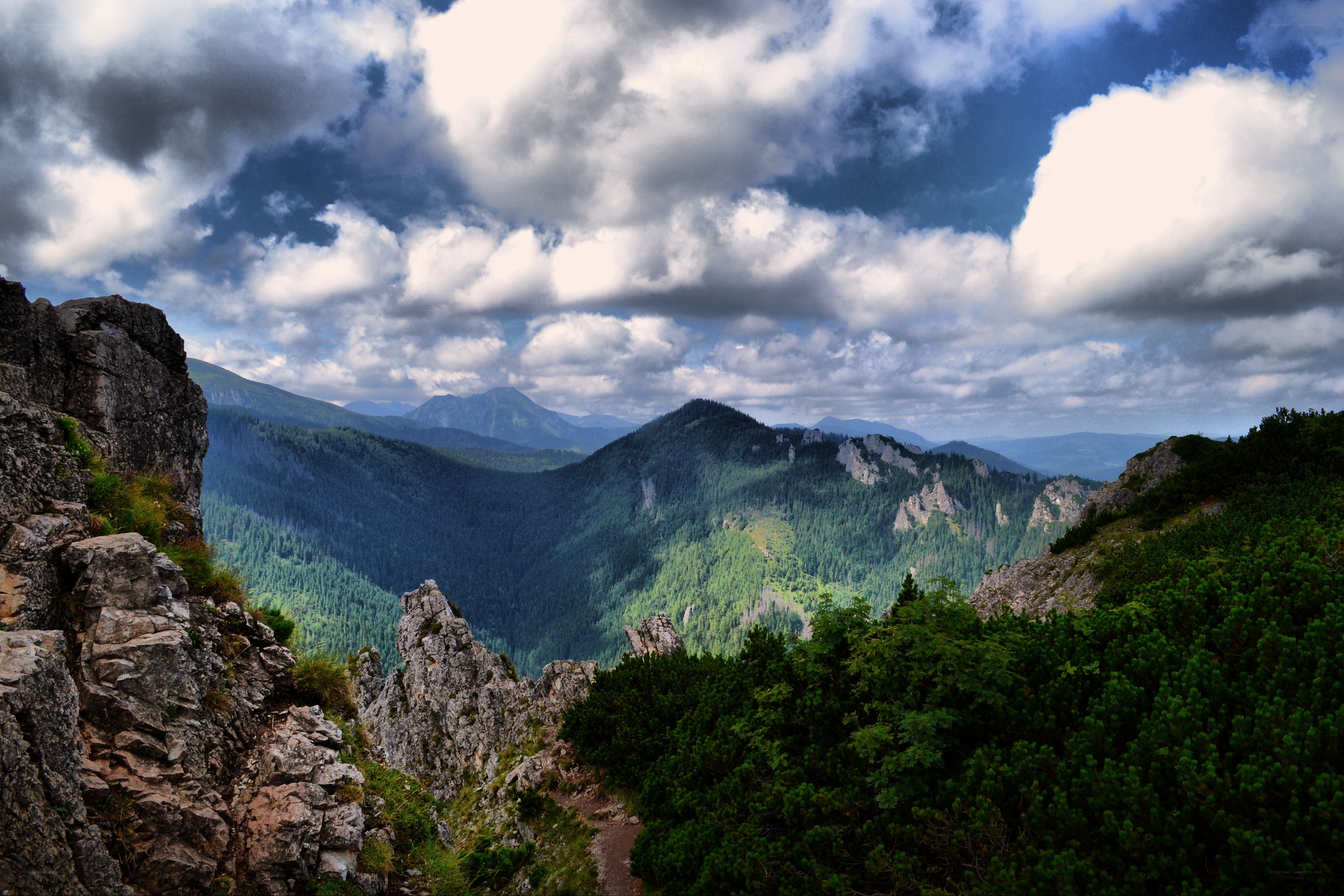 Mountain valley under cloudy sky